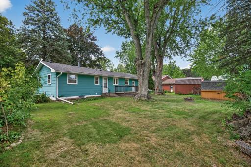 Back yard has plenty of green space. Large shade trees keep it nice and cool in the summer.