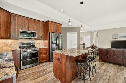 Kitchen features a pantry as well as abundant cabinets.