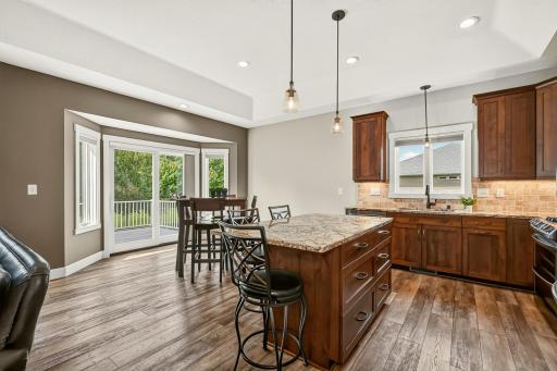 Kitchen with informal dining and patio access.