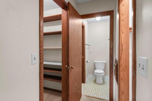 The primary bedroom offers ample closet space, including a walk-in closet, along with access to the full bathroom.