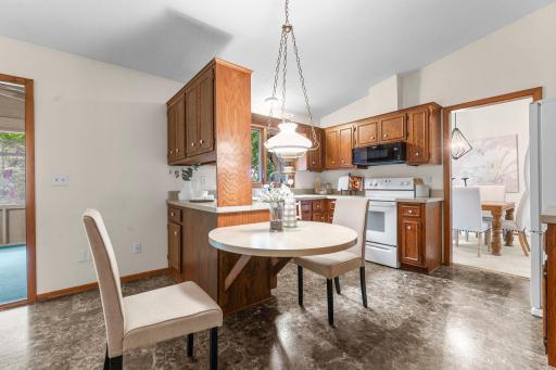 A different perspective of the kitchen highlights the cozy eat-in area.