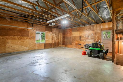 The attached 2-car garage also provides convenient stairs leading to the basement utility and laundry area.
