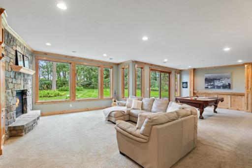 Tons of natural light pouring in with the wall of windows overlooking your gorgeous backyard