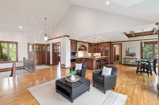 Inside, gleaming hardwood floors, beautiful woodwork, soaring ceilings, abundant natural light, and high-end finishes create an inviting sense of sophistication and comfort.