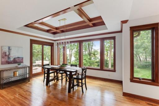A distinctive box-beam ceiling adds architectural character to the dining space.