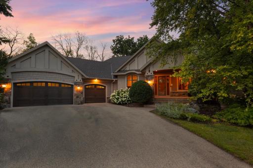 Exceptional craftsmanship, refined finishes, and effortless one-level living come together in this beautifully appointed walkout rambler in sought-after Excelsior.