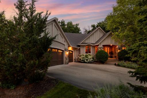 Attractive curb appeal, quality siding, architectural details, and an inviting front porch create a warm first impression, while the private, tree-lined setting provides exceptional tranquility.