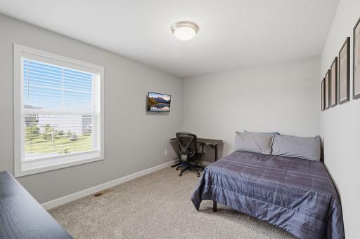 Third upper-level bedroom—ideal for a bedroom, office or guest space.