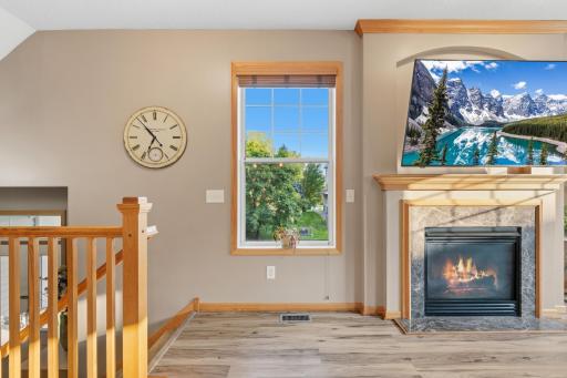 Olson fireplace and stair entrance to main floor.jpg