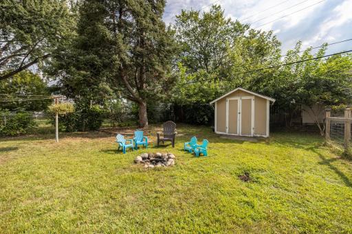 What an inviting yard, and even a convenient storage shed