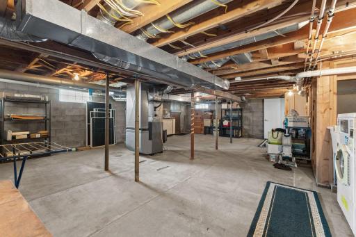 Basement showing utilities and laundry room~