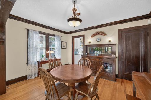Natural light and rich wood details create an inviting setting for meals and entertaining.