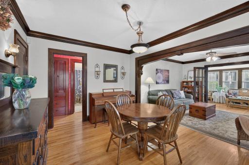 The dining room offers generous space for gathering, with a wide opening to the living room.
