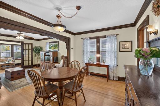 Hardwood floors and detailed millwork carry throughout the living and dining spaces.