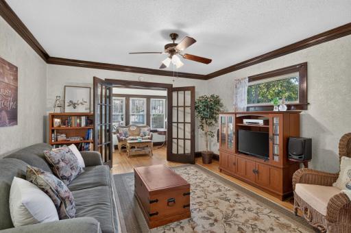Hardwood floors, natural woodwork and French doors create a warm and inviting living space.