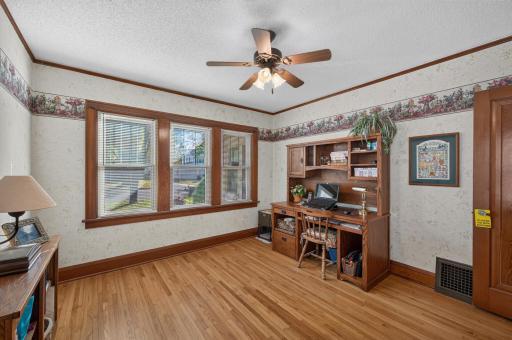 The second main-floor bedroom offers hardwood floors