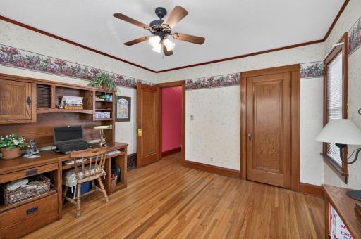 Currently used as an office, the second bedroom provides flexible space for work or guests.