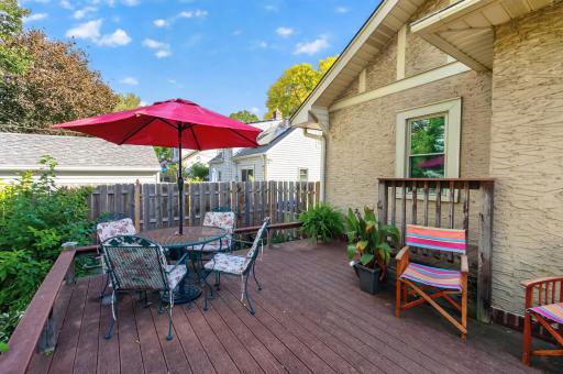 A cedar deck with composite decking offers comfortable outdoor living space just outside the home.