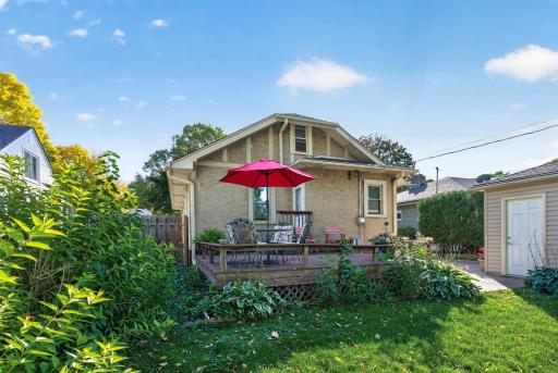 The rear deck creates a welcoming outdoor extension of the home.