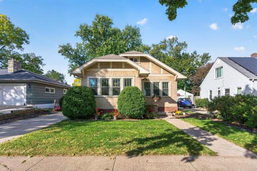 Classic stucco character, decorative roofline details and an enclosed front porch give this home lasting curb appeal.