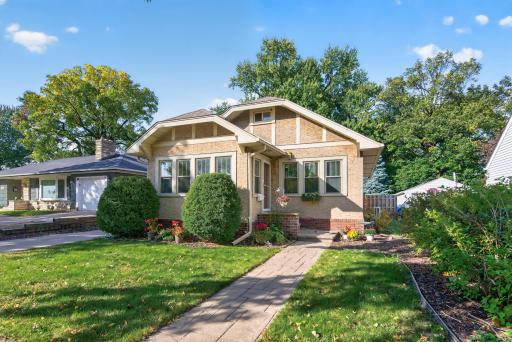 Welcome to 953 Hall Avenue! Classic architectural details, mature trees and a stamped concrete walkway create an inviting first impression.