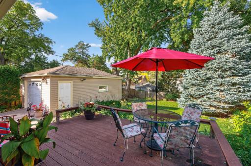 Enjoy outdoor dining on the deck overlooking the fenced backyard and detached garage.