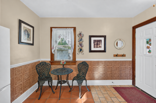 The sunny breakfast nook is a charming spot for morning coffee or everyday meals.