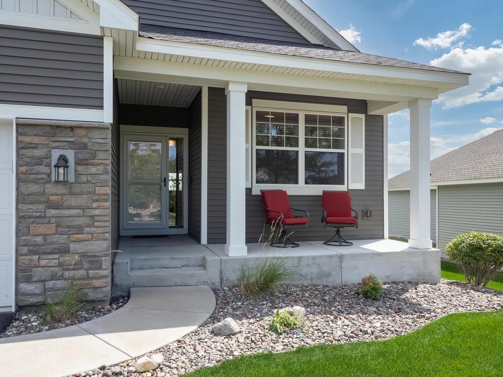 Covered front porch on this maintenance free detached townhome.