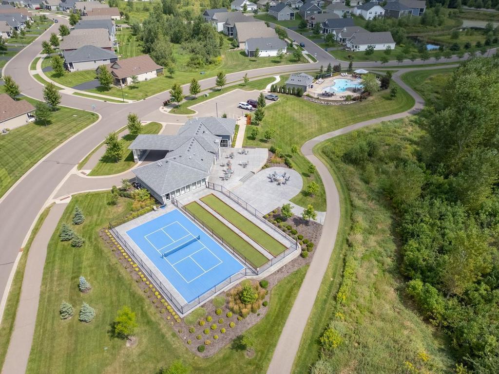 This Activity Center is private to Laurel Creek residents features pickleball and two bocce ball courts, spacious outdoor patio with large firepit, surrounded by walking/biking trails and outdoor swimming pool!