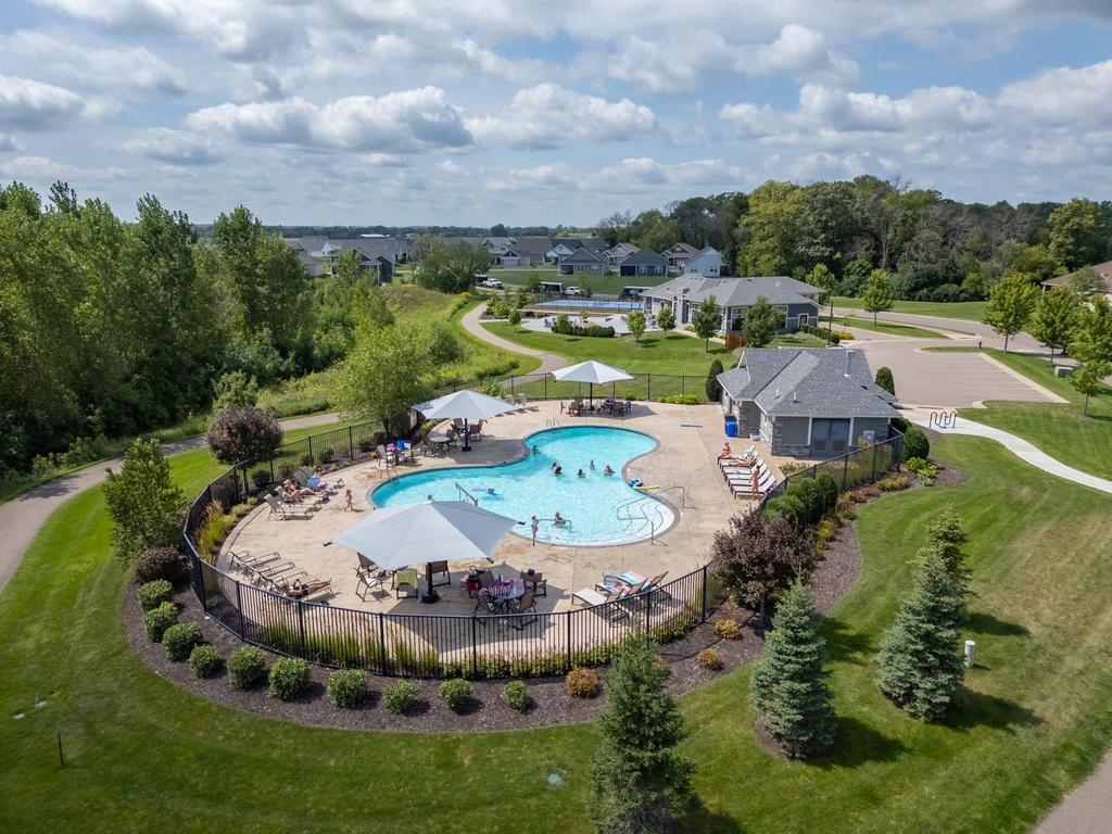 Laurel Creek private swimming pool features bathhouse with large patio area and plenty of pool furniture to kick back and relax with family/friends during the warm MN summer!