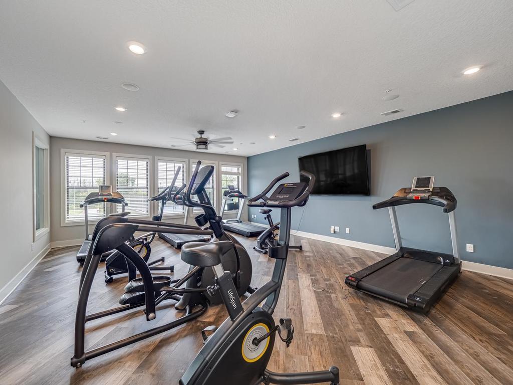 Laurel Creek Community exercise room with large flat screen tv.