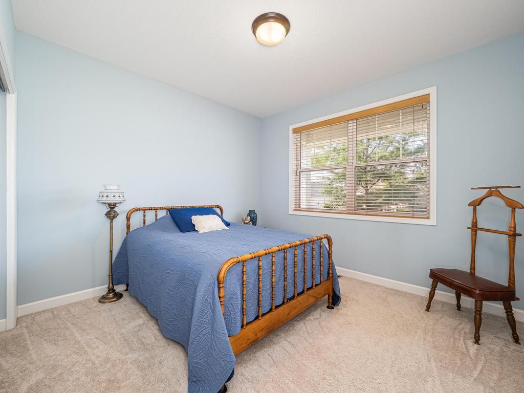 Main floor guest bedroom located in front of home could be used as an office to work from home.