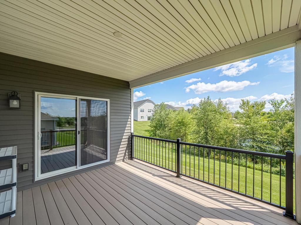 Maintenance free covered deck with awesome views of pond behind the home. Perfect for the nature lover!
