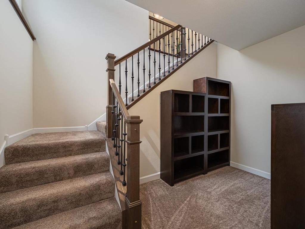 Lower landing of staircase. These storage units are not attached to the walls and can be moved to another room. They are included with the home.