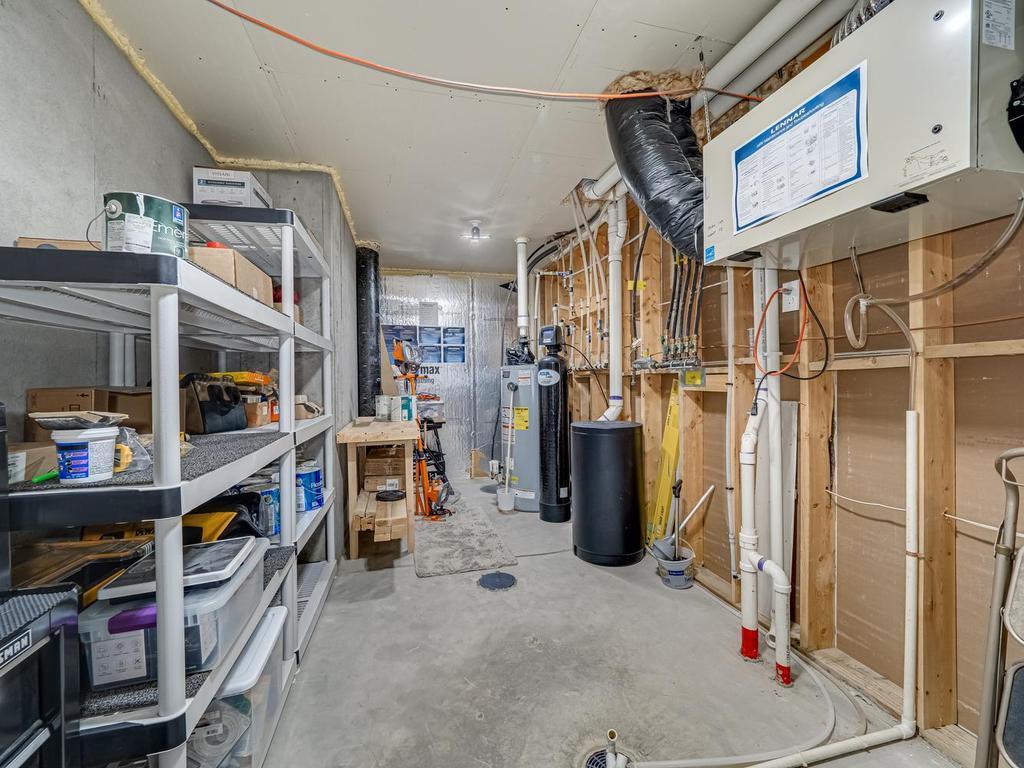 The furnace room is oversized providing more space for storage . Water softener is owned.