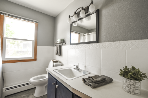 Remodeled main level full bath. Window looks to the rear of the house.
