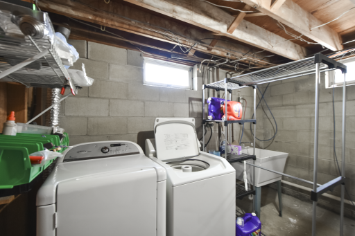 Laundry area with a utility sink for cleaning and soaking items!