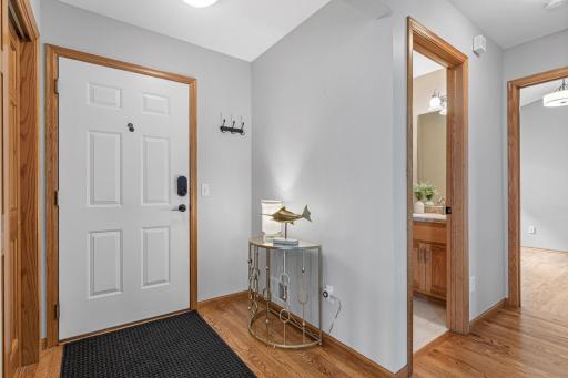 Entrance from the oversized two-car garage into the home. Located near the bathroom and second bedroom. Hardwood floors throughout and fresh paint make this home in perfect condition.