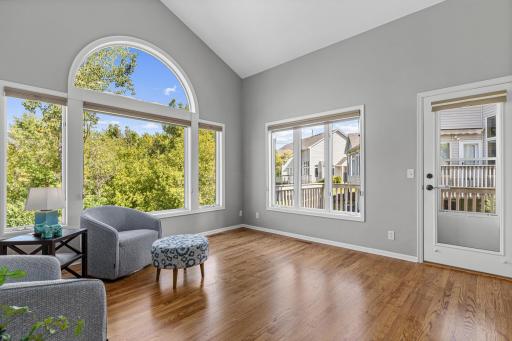 A favorite spot in the home- the vaulted four-season porch brings the outdoors in and provides dynamite year-round views. Large maintenance free deck overlooks the private backyard- enjoy coffee and reading the paper in the morning.