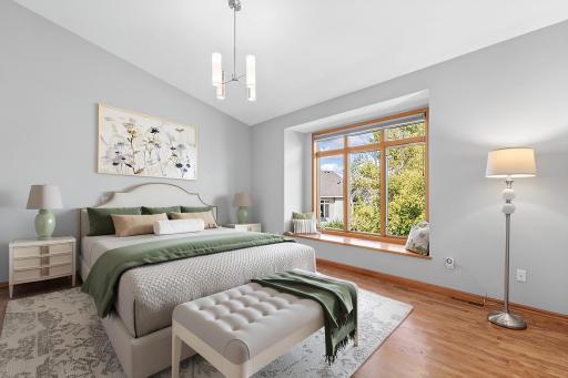 A wall of windows in the owner's suite provides the perfect picture all year round. Light, bright and welcoming- this room is a retreat at the end of the day. Visually staged.