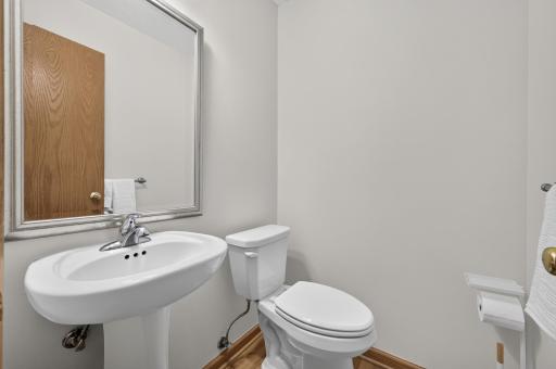 Convenient power room between the garage and the kitchen.