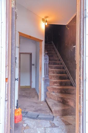 Front entry with stair way to upper level apartment