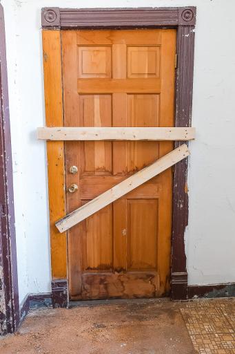 Rear door to the outside steps and back yard will need to be replaced