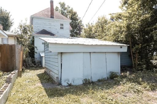 Rear garage and shed have had doors removed, but have been cleared of debris and ready for removal or modification