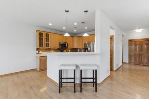 The kitchen also features, tile backsplash, glass fronts, recessed lighting, center sink and durable dove tail drawers.