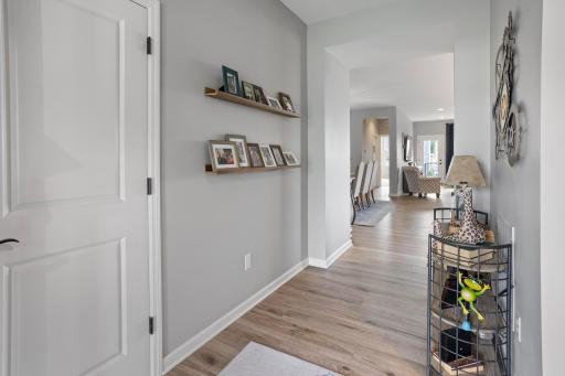 This foyer offers plenty of room for all your guests. Office is located to the right and walks around to the butler's pantry and through to the kitchen.