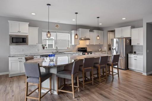 This center island offers a great space for gathering for a bite to eat or even to play some family games.
