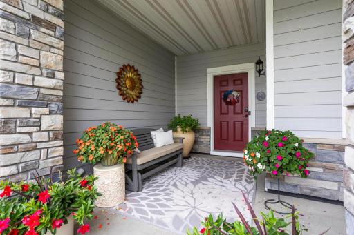 This spacious font porch is great for outdoor relaxation out of the sun.
