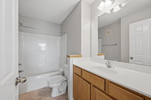 Conveniently located near the secondary bedrooms, the upper-level full bath features a tub/shower combination, along with a spacious vanity offering plenty of counter space and cabinet storage for everyday essentials.