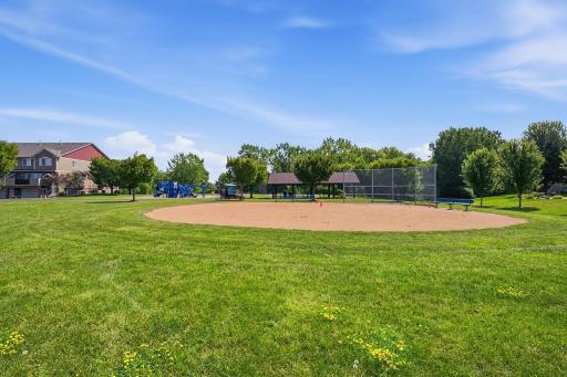 The nearby park also features a ball field and expansive open lawn, providing plenty of room for outdoor activities and adding to the open, spacious feel surrounding the community.